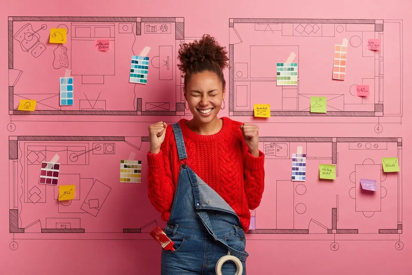 Happy young woman designer planning a modern apartment renovation.